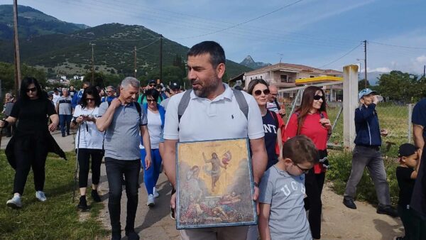 a man holding a painting