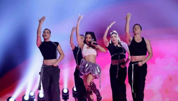 a group of people dancing on a stage