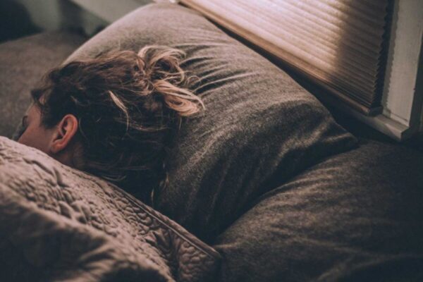 a person sleeping on a couch