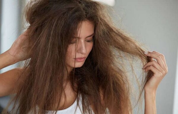 a woman holding her hair