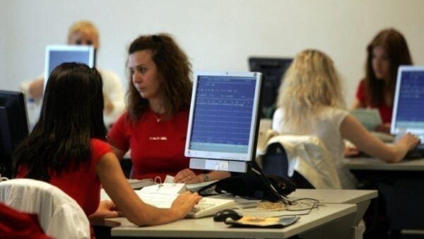 a group of women working on computers
